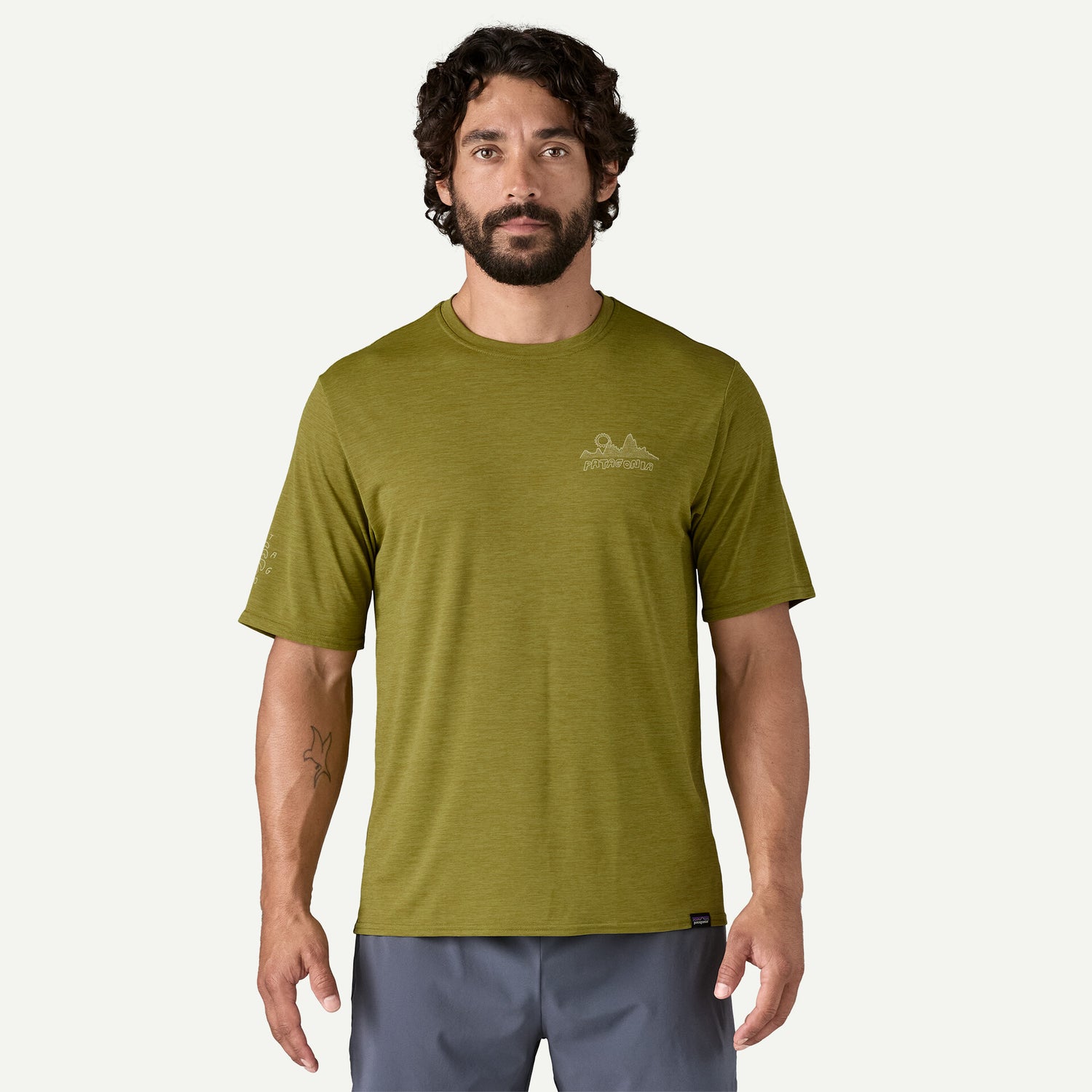 Men's Cap Cool Daily Graphic T-shirt - Lands WIND RUNNER: GRAZE GREEN X-DYE / XS